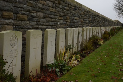 Row of headstones along the wall